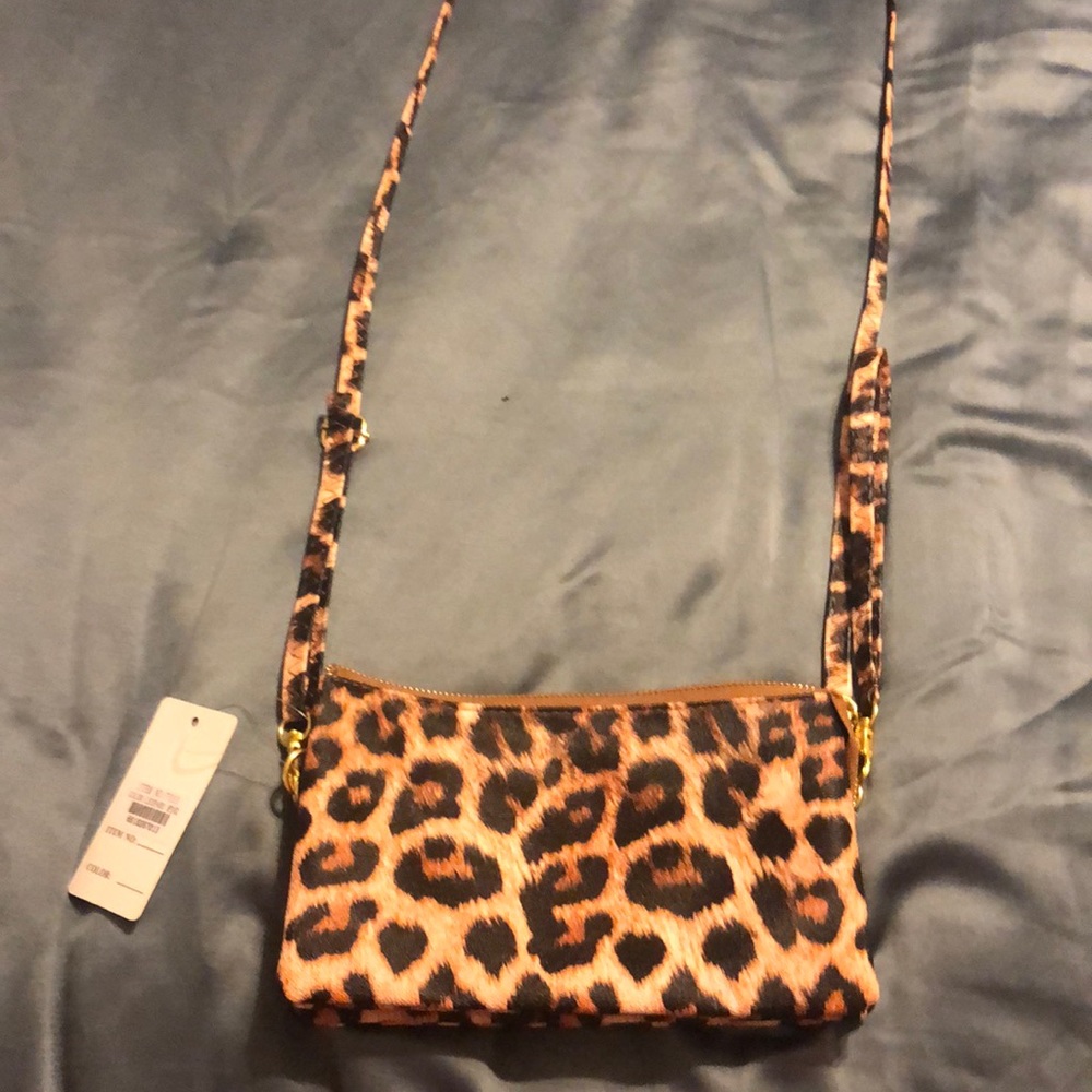 Leopard print crossbody or as a clutch. Brand new